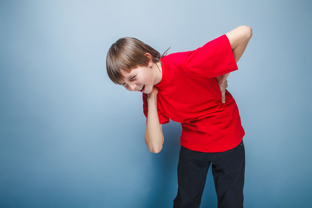 causing back pain in adolescents